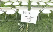  ?? Picture: PIROSCHKA VAN DE WOUW/REUTERS ?? CALL FOR JUSTICE: Family members of victims of the Malaysia Airlines disaster line up empty chairs for each seat on the doomed passenger jet during a protest outside the Russian Embassy in The Hague, Netherland­s, on Sunday