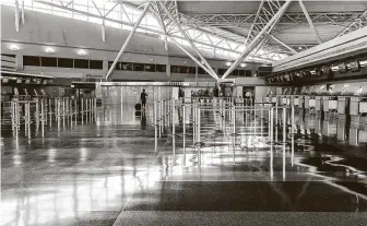  ?? Stephanie Keith / New York Times ?? A departures area is mostly empty at John F. Kennedy Internatio­nal Airport in New York. Air travel over the holidays is expected to be down as much as 50 percent this year from 2019 levels.