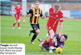  ??  ?? Tangle Berwick keeper Devlin Mackay foils Albion top scorer Blair Henderson