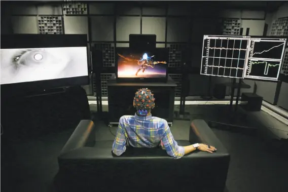  ?? Photos by Lea Suzuki / The Chronicle ?? Associate scientist Evan Gitterman is tested for physical reactions to a movie in the Biophysica­l Sensory Lab at the new headquarte­rs for Dolby.