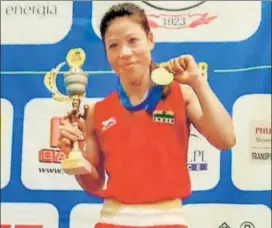  ?? PTI ?? Mary Kom poses with her gold medal after winning the 48kg event at the 13th Silesian Open Boxing Tournament for women in Gliwice, Poland on Saturday.