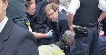  ??  ?? PLAUDITS Tobias Ellwood yesterday, left, and trying to save Keith, above