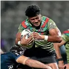  ?? GETTY IMAGES ?? Prop Poasa Faamausili, left, is returning to the injury-hit Sydney Roosters after a loan spell with the Warriors. Jason Taumalolo of the Cowboys is wrapped up by the Knights defence in Townsville last night.