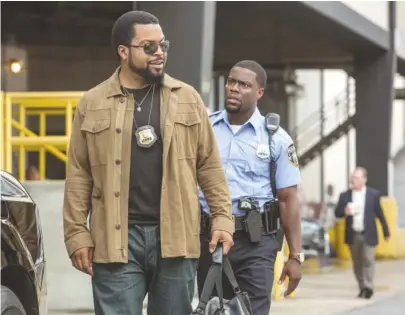  ?? | UNIVERSAL PICTURES ?? Fresh fromthe academy, new cop Ben (Kevin Hart, right) goes toMiami with James (Ice Cube) in “Ride Along 2.”