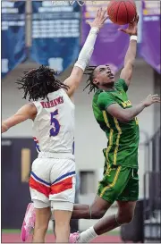  ?? SARAH GORDON/THE DAY ?? New London’s Devan Williams goes up for a shot over Bloomfield’s Cayden Smith (5) during Wednesday’s CIAC Division III semifinal at the Floyd Little Athletic Center in New Haven. The Whalers lost 78-59.