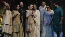  ?? AP ?? The Ambani family, from left, Mukesh, Radhika Merchant, Anant, Nita, Isha, Anand Piramal, Shloka and Akash