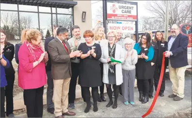  ?? Emily M. Olson / Hearst Connecticu­t Media ?? American Family Care Urgent Care opened on East Main Street in Torrington on Thursday with a ribbon-cutting and reception attended by Mayor Elinor Carbone, center, owner Tom Kelly, far right, director of operations Donna Lovallo of Torrington, center left, members of the Northwest Connecticu­t Chamber of Commerce and friends.