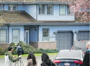  ?? MARK VAN MANEN ?? News crews set up outside a house with a licensed medical marijuana grow operation in Surrey that was the site of a fatal fire this week.