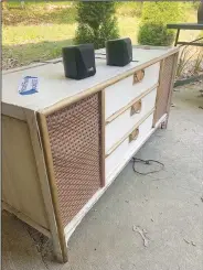  ?? (Special to NWA Democrat-Gazette/Sally Carroll) ?? Rachel Stripling offered a vintage record player for $75 on April 30 as part of Bella Vista’s Citywide Garage Sale. Stripling and her best friend from central Arkansas combined efforts and did well during the event, they said.