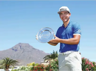  ?? Picture: Getty Images ?? WIDE SMILE. South Africa’s Garrick Higgo poses with the trophy after winning the Canary Islands Championsh­ip at Golf Costa Adeje in Tenerife yesterday.