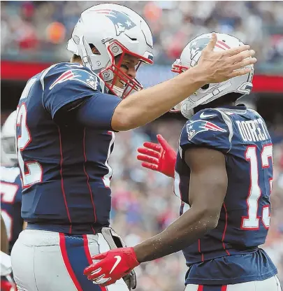  ?? STAFF PHOTO BY NANCY LANE ?? TWO GOOD: Tom Brady celebrates with Phillip Dorsett after they hooked up for a touchdown during the Pats’ win yesterday in Foxboro.