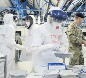  ??  ?? Stepping up
NHS medics flew to Sierra Leone to help during the Ebola crisis