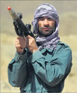  ?? AFP ?? An anti-taliban fighter belonging to the Afghan resistance movement stands guard in Kotal-e Anjuman of Paryan district in Panjshir province.