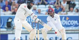  ??  ?? England's Moeen Ali plays a shot on the fourth day of second Test against West Indies on Monday. Ali 84, Root 72, Woakes (61no), Malan 61, Stokes 58 took England to 490/8 (declared) in their second innings giving Windies victory target of 322