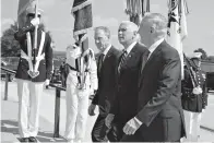  ?? AP Photo/Evan Vucci ?? ■ Vice President Mike Pence, center, is greeted by Deputy Secretary of Defense Pat Shanahan, left, and Secretary of Defense Jim Mattis before speaking Thursday at an event on the creation of the U.S. Space Force at the Pentagon.