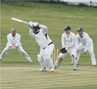  ??  ?? Murton batsman Alan Welburn hits a single in last Saturday’s clash with Silksworth. Pictures by Kevin