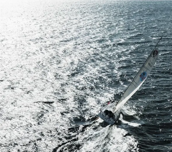  ??  ?? Alone on the open ocean is where Wilson has spent most of his sea time, below before the Vendée Globe, and at right in 2004, on board the ORMA 50 Multihull Great American II. He completed the Transat, from Plymouth, England, to Boston in 15 days. PHOTO...