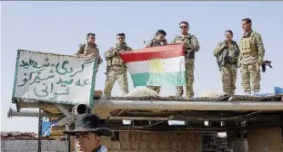  ?? Ansa ?? Kurdistan e i sogni dei Peshmerga Uomini delle truppe curdo-irachene a Kirkuk, città petrolifer­a nella regione autonoma ripresa nei giorni scorsi dalle truppe di Baghdad