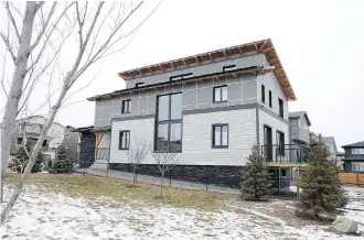  ?? PHOTOS: WIL ANDRUSCHAK ?? The energy-efficient Symons Gate “Passive House” is at 274 Sage Bluff Dr. N.W.