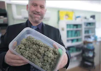  ?? JONATHAN HAYWARD/THE CANADIAN PRESS ?? Dana Larsen, who runs his cannabis business without a permit, is among many pot advocates and grey market participan­ts who feel they have been excluded from the new regime.