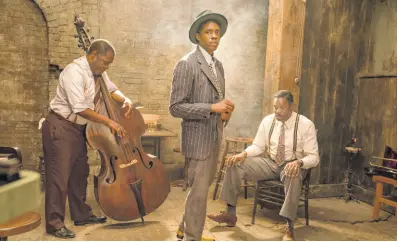  ?? AP ?? From left: Michael Potts, Chadwick Boseman and Colman Domingo in a scene from ‘Ma Rainey’s Black Bottom’.