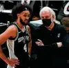  ?? Nam Y. Huh / Associated Press ?? Gregg Popovich, right, and Derrick White credit strong defensive effort for the rally.