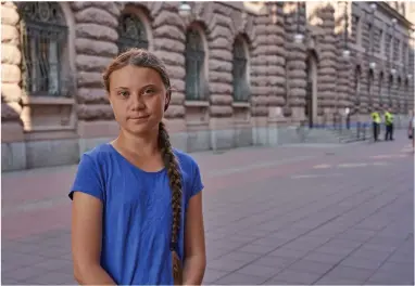  ?? AP PHOTO BY DAVID KEYTON ?? In this photo taken on Friday, July 26, 2019, Greta Thunberg stands next to Swedish parliament in Stockholm. Thunberg, the Swedish teenager whose social media-savvy brand of eco-activism has inspired tens of thousands of students in Europe to skip classes and protest for faster action against climate change, said Monday, July 29, 2019 that she plans to take her message to America the old-fashioned way: by boat.