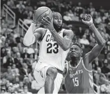  ?? Brett Coomer / Houston Chronicle ?? Cavaliers forward LeBron James, left, and Rockets center Clint Capela could become teammates before next season starts.