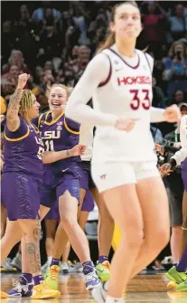  ?? TONY GUTIERREZ/AP ?? Virginia Tech’s Elizabeth Kitley walks off the floor as LSU players celebrate in the background after a women’s national semifinal Friday night in Dallas.