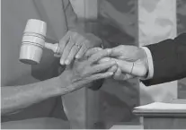  ?? CAROLYN KASTER/AP ?? House Speaker Pelosi receives the gavel from House minority leader Rep. Kevin McCarthy (R-CA) at the Capitol.