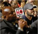  ?? CHARLIE RIEDEL / ASSOCIATED PRESS ?? People opposing a right-towork law — Propositio­n A — in Missouri attend a rally last week in Kansas City. The vote is Tuesday.