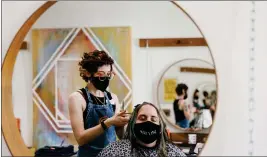  ?? DANIA MAXWELL — LOS ANGELES TIMES/TNS ?? Rachel Fishbough, left, works on Dr. Kasa Niesnerâ€™s hair. Niesner is a loyal customer who flew in from Nashville to get their hair done at the salon.