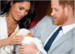  ?? AFP file ?? PRIVACY MATTERS: Prince Harry and his wife Meghan pose for a photo with their newborn baby son Archie in St George’s Hall at Windsor Castle in Windsor, west of London.—