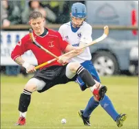  ??  ?? Photograph: Neil Paterson. Lovat’s Martin Mainland holds off Glasgow Mid Argyll’s Calum McLay during last weekend’s Premiershi­p match at Balgate.