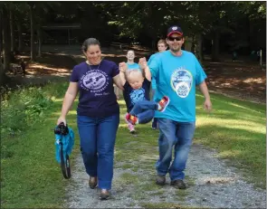  ?? SUBMITTED PHOTOS ?? Jessica Dixon and her husband, Andy, joined the Southern Maryland Down Syndrome Associatio­n Buddy Walk with their son, Aaron, last Sunday. The yearly walk is the group’s largest fundraiser and activity that brings families together from the area.