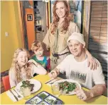  ??  ?? Mary Apple (center) and her husband John (with daughter Bombette, 11, and son Kayo, 7) are avoiding takeout and restaurant­s because of germs.