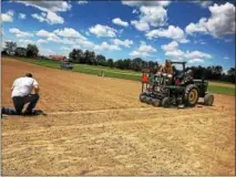  ?? PHOTO PROVIDED BY CORNELL UNIVERSITY ?? Cornell University workers plant a field of hemp for a research project to determine which varieties are most suitable for growing in New York state.