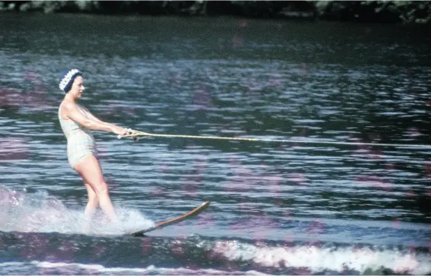  ?? RAY BELLISARIO / POPPERFOTO / GETTY IMAGES ?? Princess Margaret water-skiing at Sunninghil­l Park, Windsor on July 9, 1967. This image is one of a series taken by Ray Bellisario who was credited with being the “original paparazzo” and someone who frequently upset the Royal family with his informal...