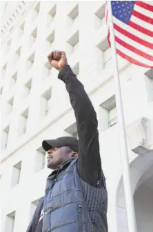  ??  ?? Moore protests outside the Los Angeles Hall of Justice.