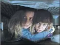  ?? Focus Features ?? Oliver and his mom (Azhy Robertson and Gillian Jacobs) find a “safe” place to hide.