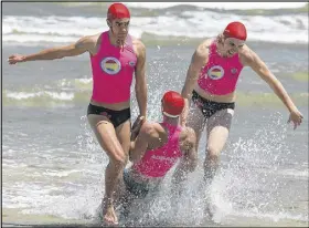  ?? JOSH CHAPMAN PHOTO ?? Canadian teammates Dean Sangster, left, and Rylun Alberg-moore pull Ethan Placek to safety during the tube rescue event at the world lifesaving championsh­ip at Glenelg Beach, Australia. Sangster, from Truro, helped the national junior men’s team achieve a seventh-place overall finish at the 19-country event.