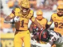  ?? JOE RONDONE/THE REPUBLIC ?? Arizona State running back Xazavian Valladay (1) runs past Oregon State defender Kitan Oladapo (28) on Saturday.