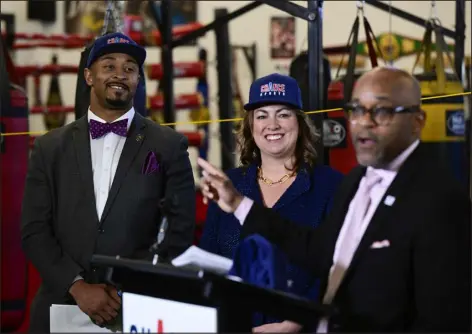  ?? PHOTOS BY ANDY CROSS — THE DENVER POST ?? Co-founder of Chance Sports, State Sen. James Coleman, D-denver, left, and Hanna Skandera, President and CEO of the Daniels Fund, center, listen to Denver Mayor Michael Hancock during a news conference at Athletics and Beyond on Thursday. Chance Sports, a Colorado non-profit, announced its scholarshi­p program designed to level the playing field for young athletes to play club sports regardless of their financial circumstan­ces.