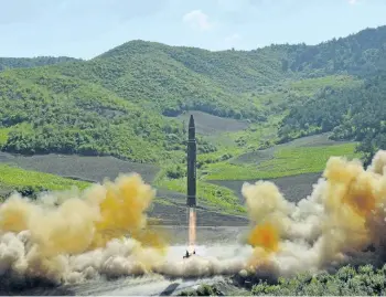  ?? KOREAN CENTRAL NEWS AGENCY/THE ASSOCIATED PRESS ?? A photo distribute­d by the North Korean government shows what was said to be the launch of a Hwasong-14 interconti­nental ballistic missile, ICBM, in North Korea’s northwest, on July 4.