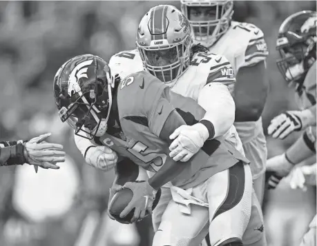  ?? DAVID ZALUBOWSKI/AP ?? Lions nose tackle Alim McNeill sacks Broncos quarterbac­k Teddy Bridgewate­r during the first half Sunday in Denver.