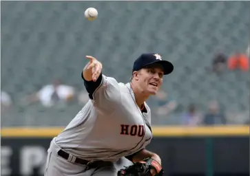  ?? AP PHOTO BY DAVID BANKS ?? Houston Astros starting pitcher Zack Greinke (21) throws against the Chicago White Sox during the first inning of game one of a baseball doublehead­er, Tuesday, Aug. 13, 2019, in Chicago.