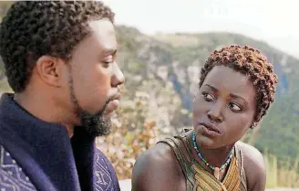  ?? [PHOTO PROVIDED BY DISNEY-MARVEL STUDIOS] ?? “Black Panther” — with king T’Challa (Chadwick Boseman) and Nakia (Lupita Nyong’o) — is one of at least 11 superhero films coming in 2018.