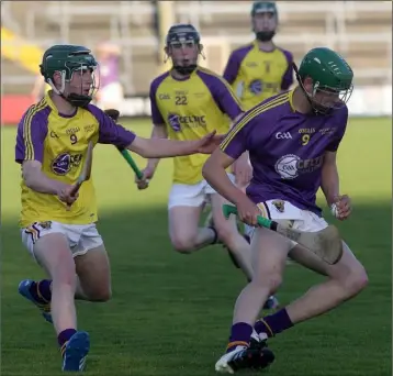  ??  ?? Liam Coleman (Wexford Purple) steals a march on Conor Morris (Wexford Gold) in the Bank of Ireland Under-17 hurling Celtic Challenge derby in Innovate Wexford Park on Wednesday.