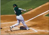  ?? JOSE CARLOS FAJARDO — STAFF PHOTOGRAPH­ER ?? The A’s’ Matt Olson connects for a single in the first inning against the Padres at the Coliseum on Sunday.