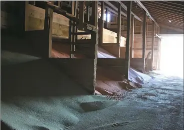  ?? Mona Weatherly ?? Pale hues of green, peach and pink show the different components of fertilizer at Trotters Fertilizer in Broken Bow. Despite high prices, there should be enough fertilizer for producers to apply to crops this year.